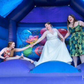 Falling over is all part of the fun on a bouncy castle, Mercure Lambert Hotel wedding, Thame