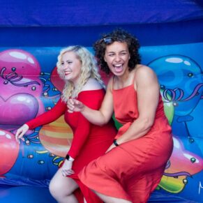 These ladies enjoying a few fun moments on the bouncy castle at this Mercure Lambert Hotel wedding, Thame
