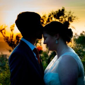 Silhouette sunset pose of the newlyweds on their wedding day at The Mercure Lambert Hotel, Thame
