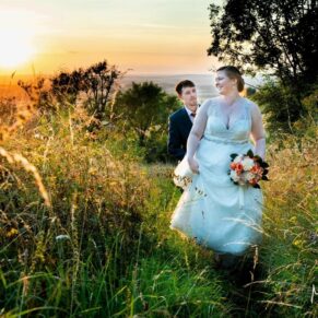 A sunset stroll for the bride and groom at their Mercure Lambert Hotel wedding, Thame