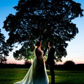 Dusk pose of the newlyweds on their wedding day at The Mercure Lambert Hotel, Thame