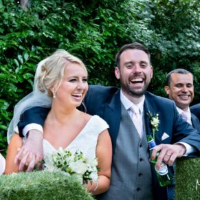 The bride and groom beside the giant love letters, captured at The Grange, Northwood wedding