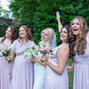 The ladies larking around captured at The Grange, Northwood wedding