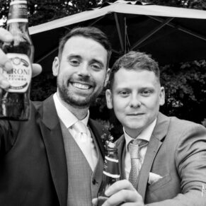 The groom and friend pose for the camera at The Grange, Northwood wedding
