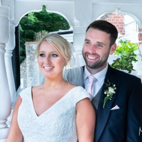 A portrait of the newlyweds captured in the venue entrance at The Grange, Northwood wedding