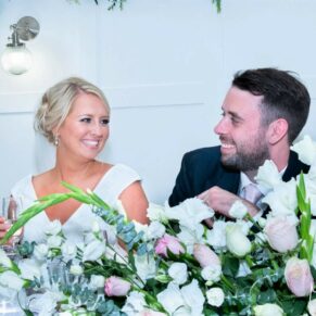 The bride and groom captured during the speeches at The Grange, Northwood