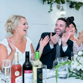 The newlyweds reactions captured during the speeches at The Grange, Northwood