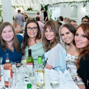 A table group pose captured at The Grange, Northwood wedding