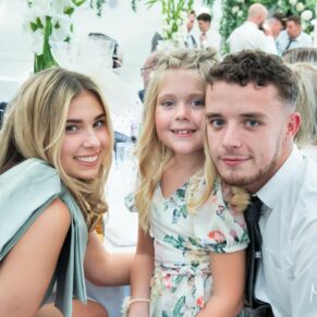 Three wedding guests captured during the meal at The Grange, Northwood