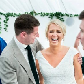 The bride and a friend enjoying the banter, captured at The Grange, Northwood