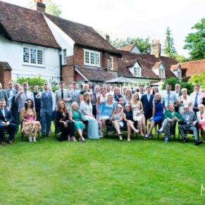 A large group pose captured at The Grange, Northwood wedding