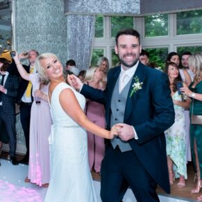 The newlyweds captured during their first dance at The Grange, Northwood wedding