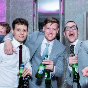 Three lads captured during the drinks reception at The Grange, Northwood wedding
