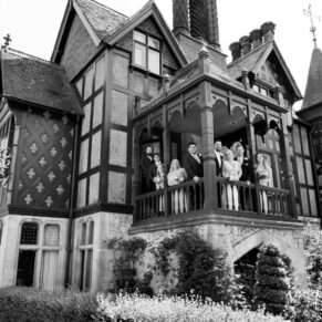 Five Arrows Hotel wedding photography group pose on the balcony