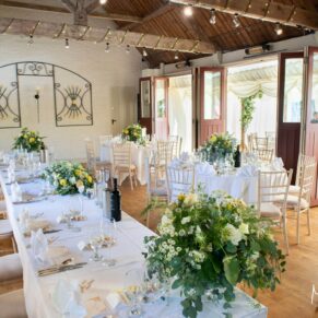 Interiors of the former stables beautifully setup for the wedding meal just prior to the guests arriving