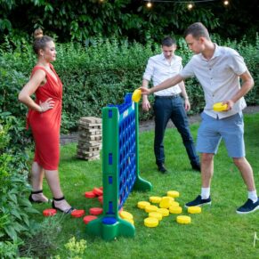 Five Arrows Hotel wedding photography of the Jenga game in full swing