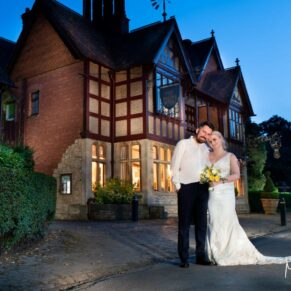 The newlyweds at dusk outside the The Five Arrows Hotel soon after the lights fade - some floodlighting effects have been used here to create the wow factor