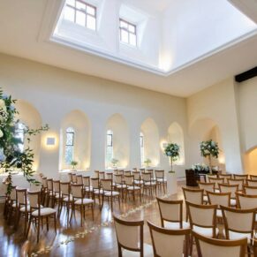 A wide angle view of the ceremony room setup at Farnham Castle