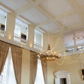 Wide view of the grand interior setup for the wedding breakfast