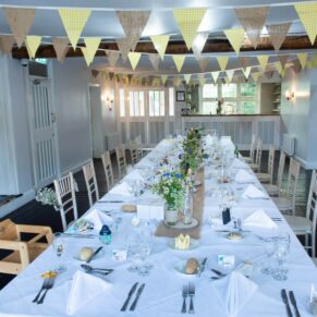 Gorgeous wedding breakfast setup for the meal in The Malt House at The Olde Bell in Hurley