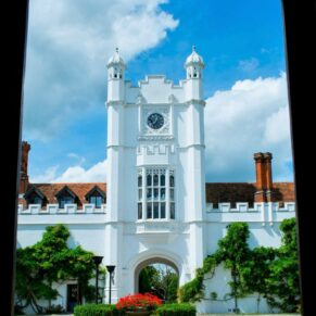 Danesfield House exteriors captured through one of the many archways at this historic wedding venue in Buckinghamshire