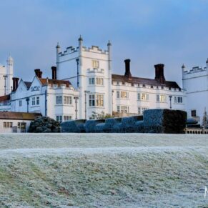 Danesfield House captured across the lawns on a frosty wedding December morning in the Chilterns