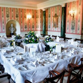 The atmospheric Doric Dining Room all setup for the wedding breakfast at Hartwell House
