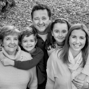 This relaxed family portrait pose was captured in a woodland setting in Amersham