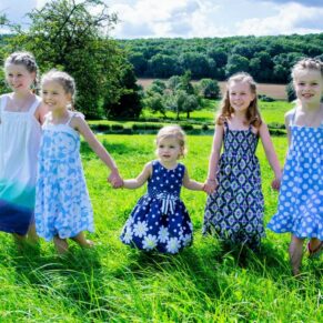 This sisters walking shot captured on a Chilterns hilltop family portrait session