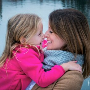 This relaxed mother and daughter pose was captured beside the River Thames in Marlow in Buckinghamshire during a fun packed photography portraits session
