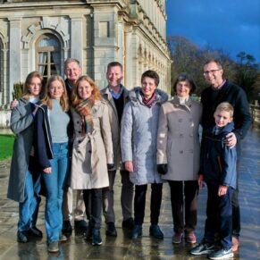 Family group pose at Cliveden House with low evening sunlight