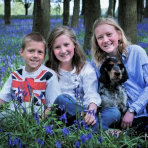 Fun kids portrait captured in some Buckinghamshire woodland bluebells near Amersham