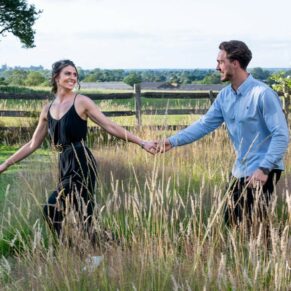 Engagement session captured in the Buckinghamshire countryside - this couple are running through a tall grass meadow