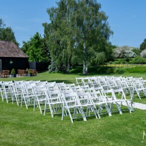 The outdoor civil ceremony setup in the venue's wonderful grounds on a perfect summer's day