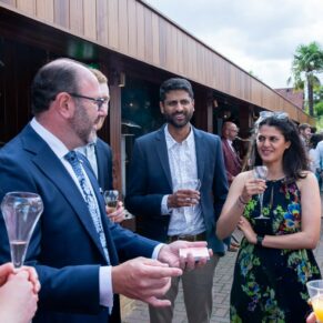 Reportage capture of some of the wedding guests in the grounds of The Crazy Bear Hotel in Stadhampton during the drinks reception