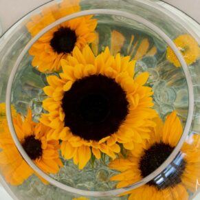 Sunflower table centre captured from above - these stunning flowers are great if you want to add a splash of colour on your special day