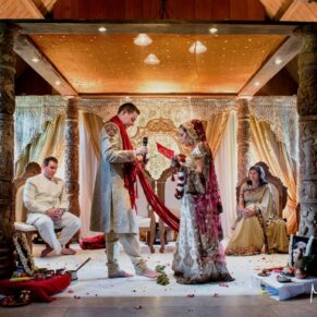 Buckinghamshire Asian Wedding Photography of the ceremony in progress at The Dairy on the Waddesdon Estate
