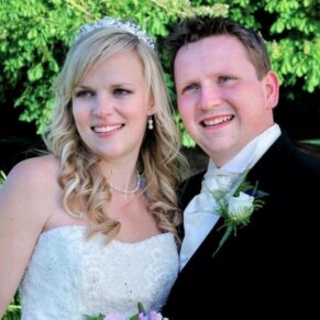 The newlyweds in a close-up pose captured outdoors during their Ardington House summer wedding