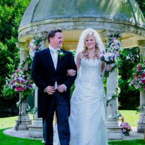 The bride and groom straight after their ceremony are warmly welcomed by their guests
