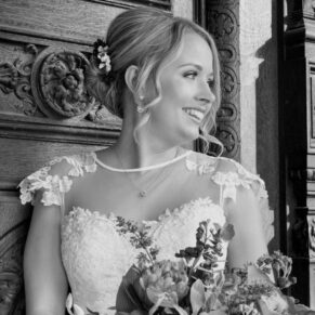Buckinghamshire Black and White Wedding Photography - close-up bridal portrait captured at Waddesdon Manor against an ornate wooden door