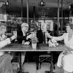 Buckinghamshire Black and White Wedding Photography - time for a drink in Henley on Thames for the newlyweds at this street cafe