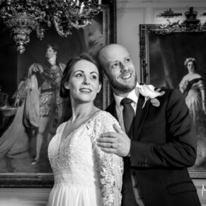 Buckinghamshire Black and White Wedding Photography - the newlyweds pose for the camera inside the Guildhall in Windsor