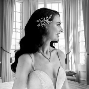 Black and white wedding photography bridal portrait pose captured pre ceremony in the bedroom at Hedsor House in Buckinghamshire