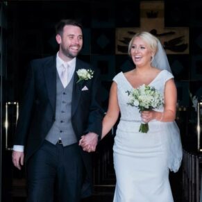 Buckinghamshire Church Wedding Photography - the newlyweds exit the ceremony to loud cheers