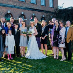Family group pose in front of the Kings Chapel in Old Amersham on a cold winter's day