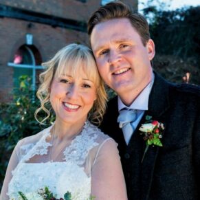 The newlyweds pose for my camera bathed in gorgeous low winter lighting at the Kings Chapel in Old Amersham