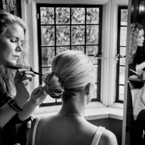 Time for some finishing touches prior to the ceremony for this bridesmaid at the Kings Chapel in Old Amersham