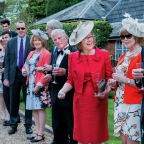Wedding guests preparing for the confetti aisle at the Kings Chapel in Old Amersham