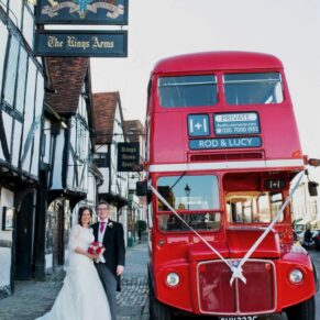 The newlyweds London red bus arrives at the High Street entrance to the Kings Chapel in Old Amersham