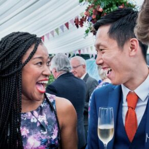 Buckinghamshire Marquee Wedding Photography - candid moment between these two smiling guests